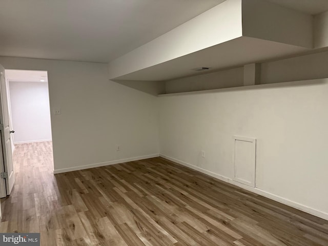 basement with wood-type flooring