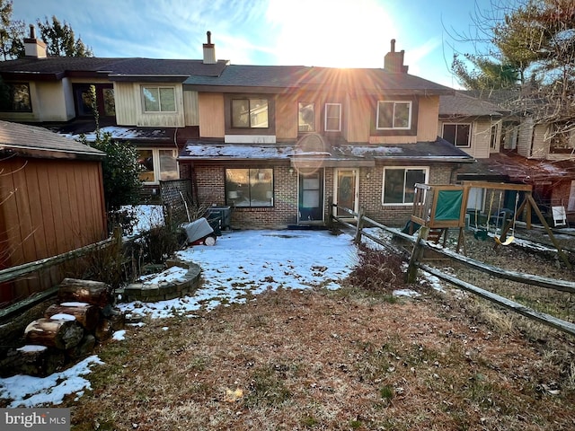 view of snow covered house