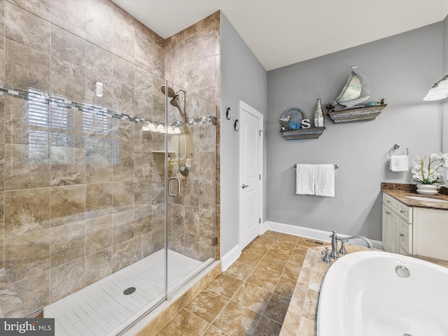 bathroom featuring vanity and an enclosed shower