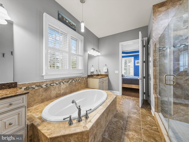 bathroom with vanity and plus walk in shower