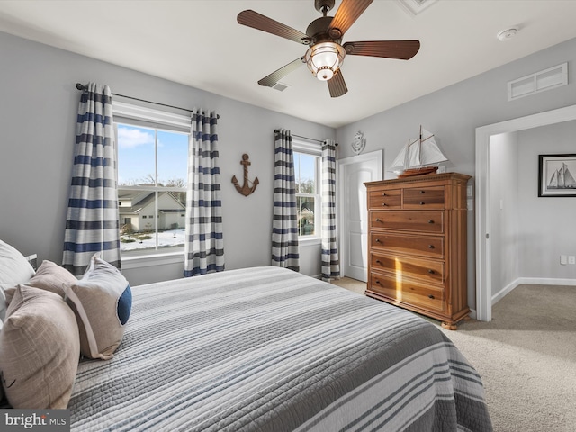 bedroom with light colored carpet and ceiling fan