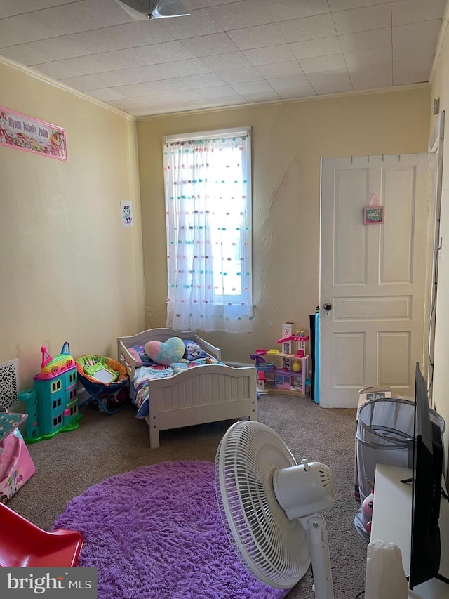 carpeted bedroom featuring ornamental molding