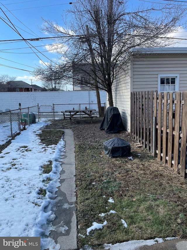 view of yard covered in snow