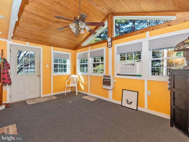 unfurnished sunroom featuring heating unit, wooden ceiling, ceiling fan, and vaulted ceiling