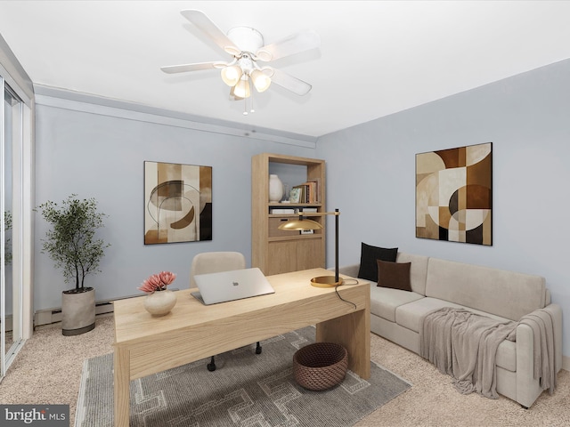 living area with a baseboard heating unit and ceiling fan