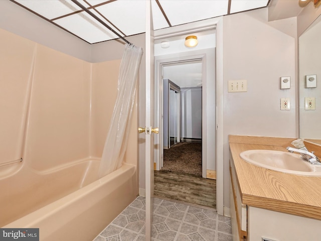 full bath with shower / tub combo with curtain and vanity