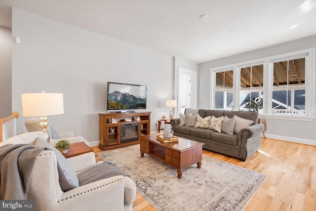 living room with light hardwood / wood-style flooring