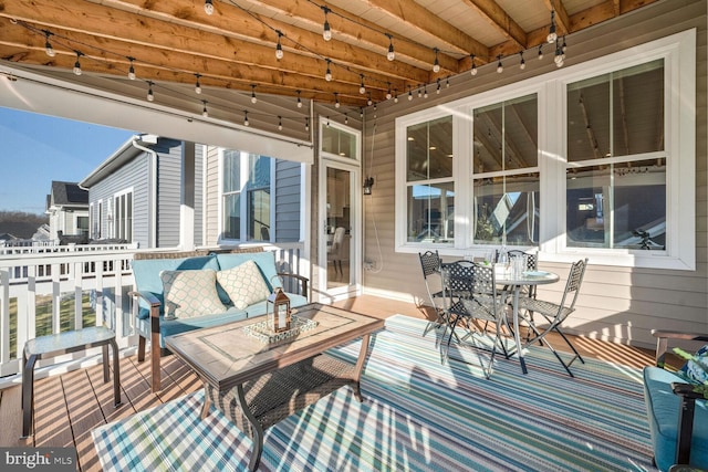 wooden deck featuring an outdoor living space