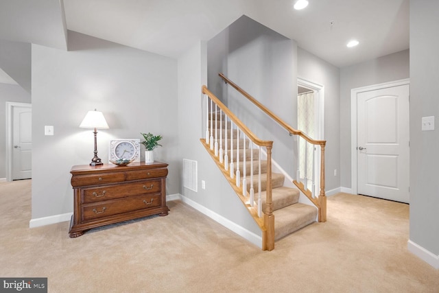 staircase with carpet floors