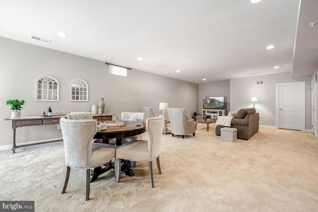 view of carpeted dining space