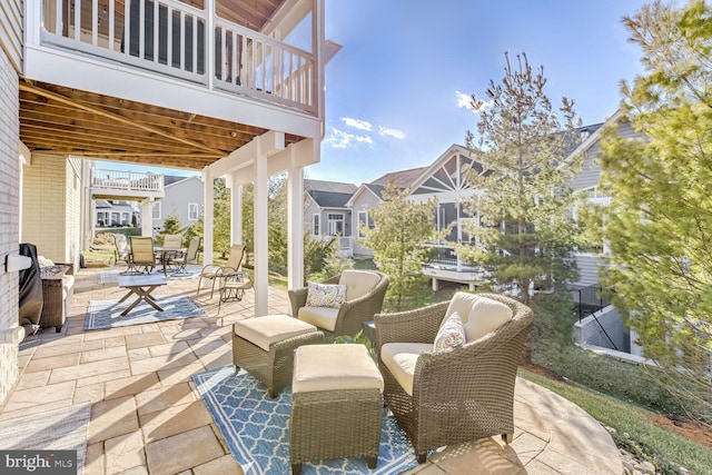 view of patio featuring a balcony