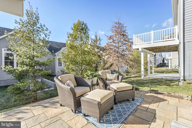 view of patio with a balcony and outdoor lounge area