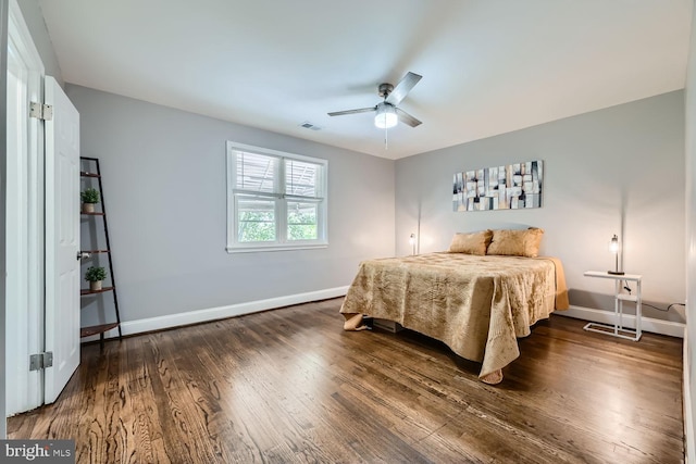 bedroom featuring ceiling fan and dark hardwood / wood-style flooring