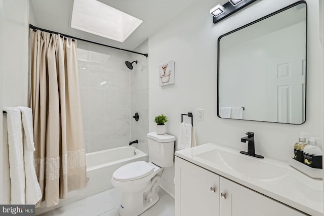 full bathroom with shower / bathtub combination with curtain, tile patterned flooring, a skylight, vanity, and toilet