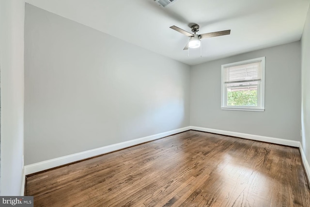 empty room with wood-type flooring and ceiling fan