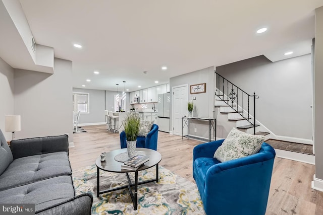 living room with light hardwood / wood-style floors