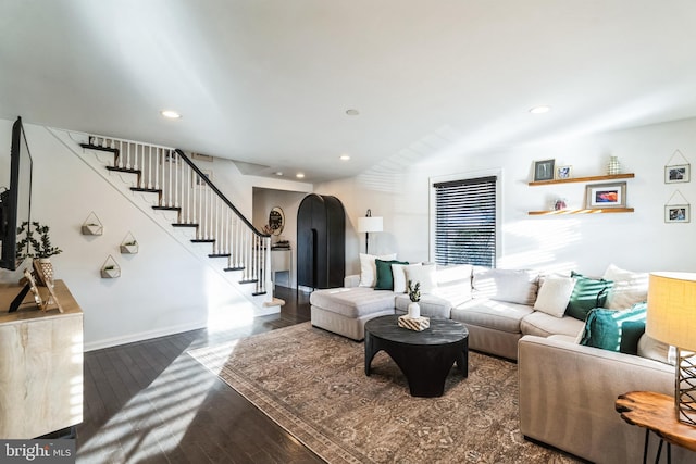 living room featuring dark wood-type flooring