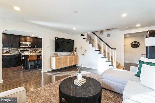 living room featuring dark wood-type flooring