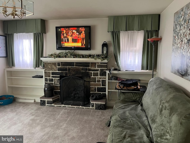 living room featuring a stone fireplace and carpet