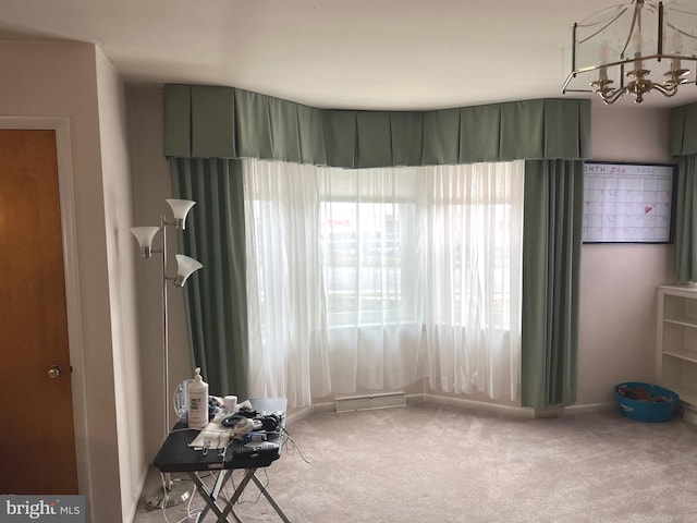 interior space with carpet flooring and a notable chandelier