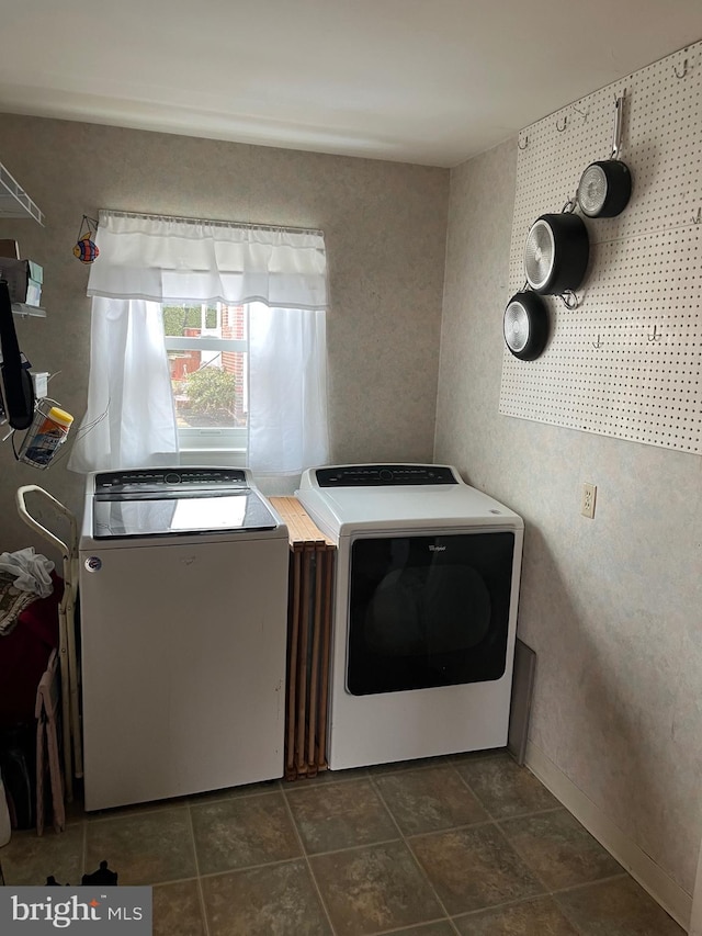 laundry room with independent washer and dryer