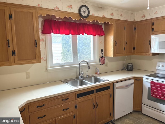 kitchen with sink, white appliances, and light tile patterned flooring