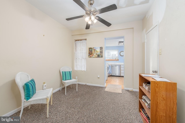 living area with ceiling fan and carpet floors