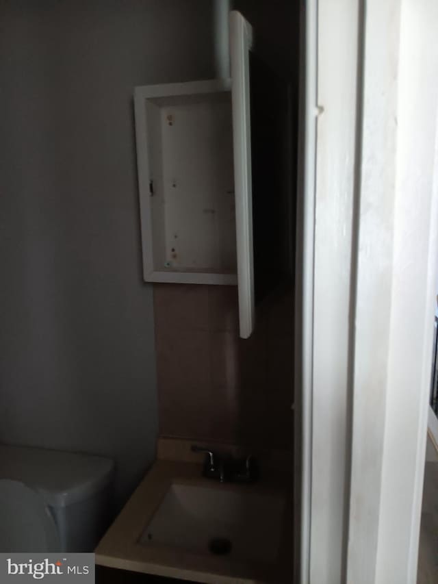 bathroom with sink and toilet