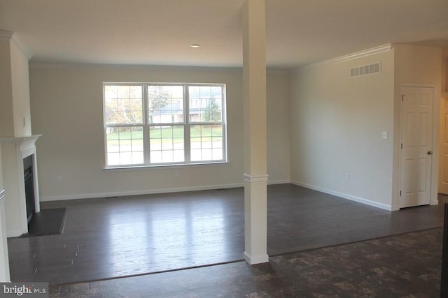 unfurnished living room with ornamental molding and dark hardwood / wood-style flooring
