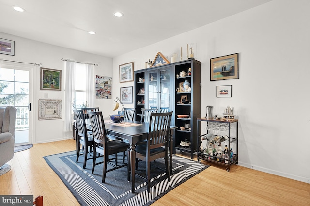 dining space featuring hardwood / wood-style floors