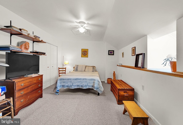 carpeted bedroom with lofted ceiling, ceiling fan, and a closet