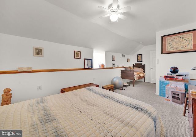 bedroom with lofted ceiling, ceiling fan, and carpet