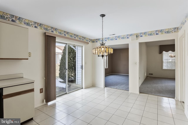 unfurnished dining area featuring plenty of natural light and light carpet