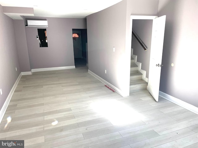 interior space featuring electric panel and light wood-type flooring