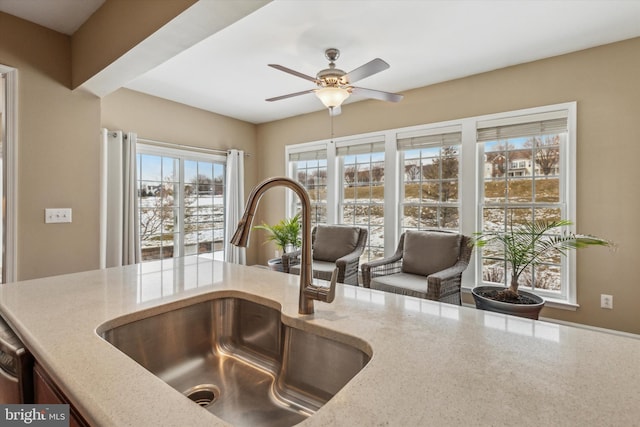 kitchen with ceiling fan and sink