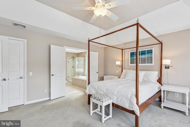 bedroom featuring ceiling fan, connected bathroom, and light colored carpet