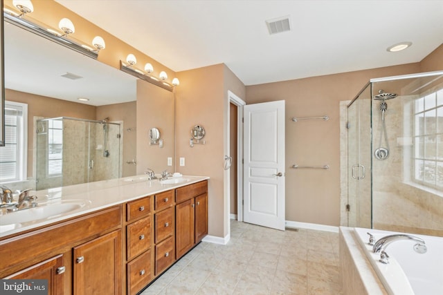 bathroom with tile patterned flooring, plus walk in shower, and vanity