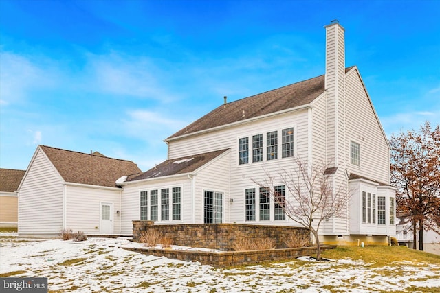 view of snow covered property