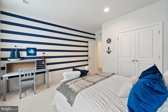 carpeted bedroom featuring a closet