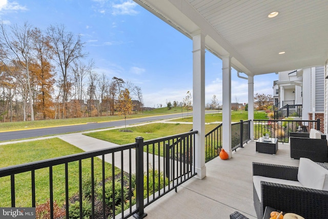 balcony featuring a porch