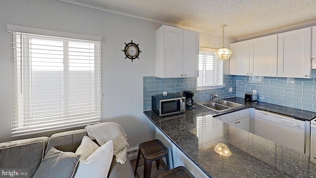 kitchen with a kitchen bar, sink, white cabinetry, white dishwasher, and pendant lighting