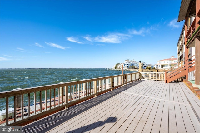 wooden deck featuring a water view