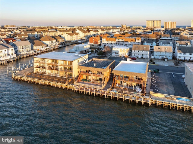 aerial view at dusk with a water view