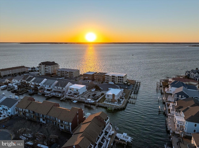 aerial view at dusk with a water view