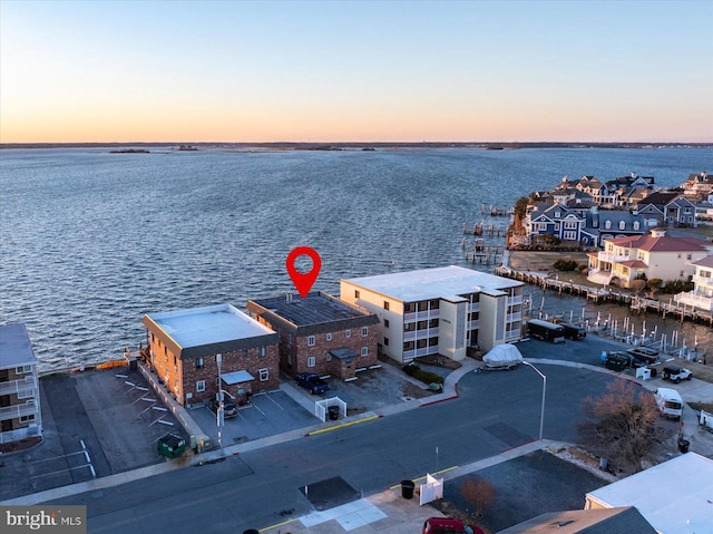 aerial view at dusk with a water view