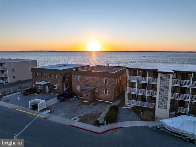 aerial view at dusk with a water view