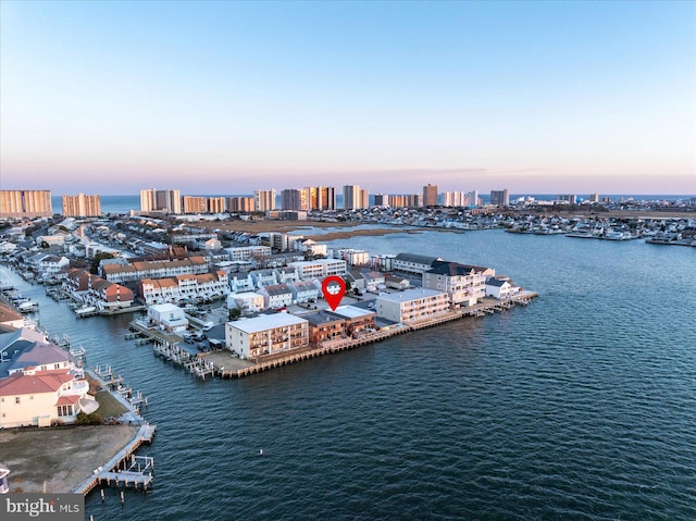 aerial view at dusk with a water view