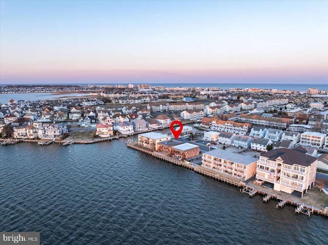 aerial view at dusk with a water view