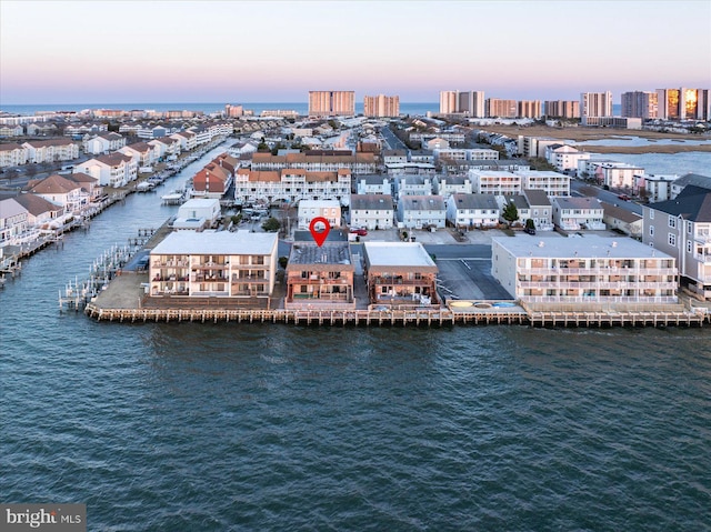 aerial view at dusk with a water view