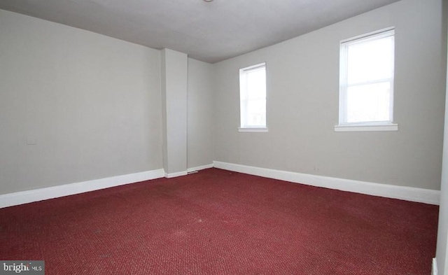 unfurnished room featuring carpet flooring